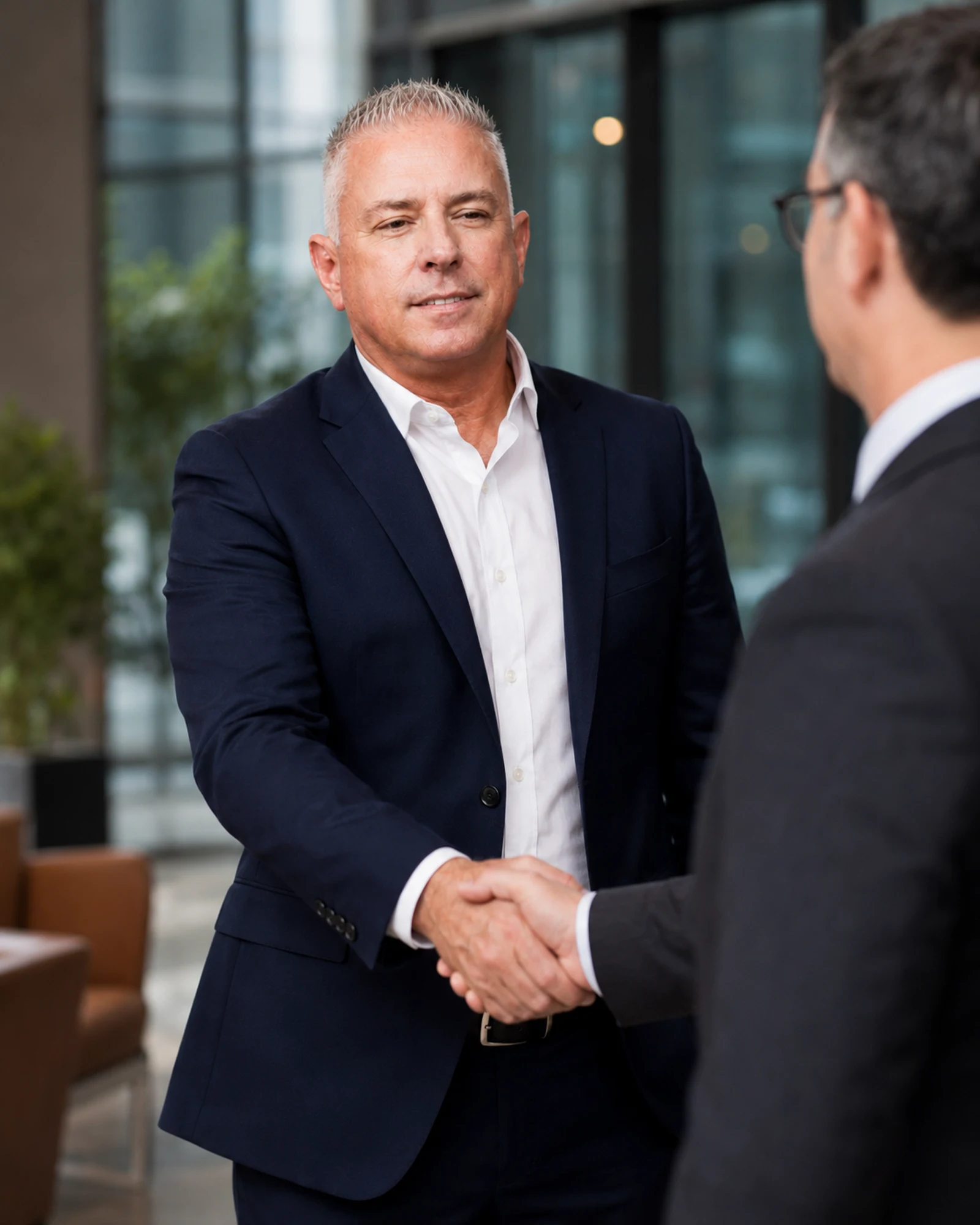 David Gembala in a professional business meeting handshake